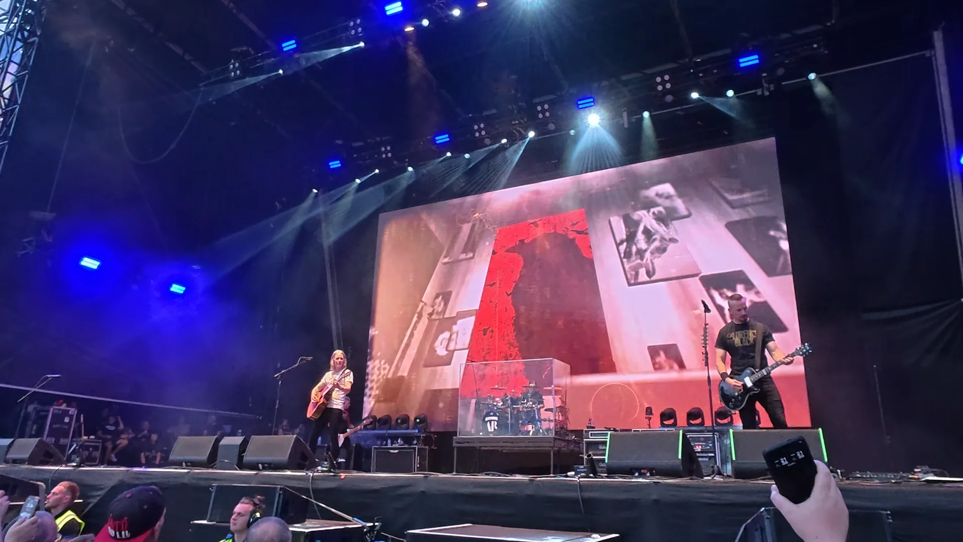 Alter Bridge performing in front of large-scale live visuals