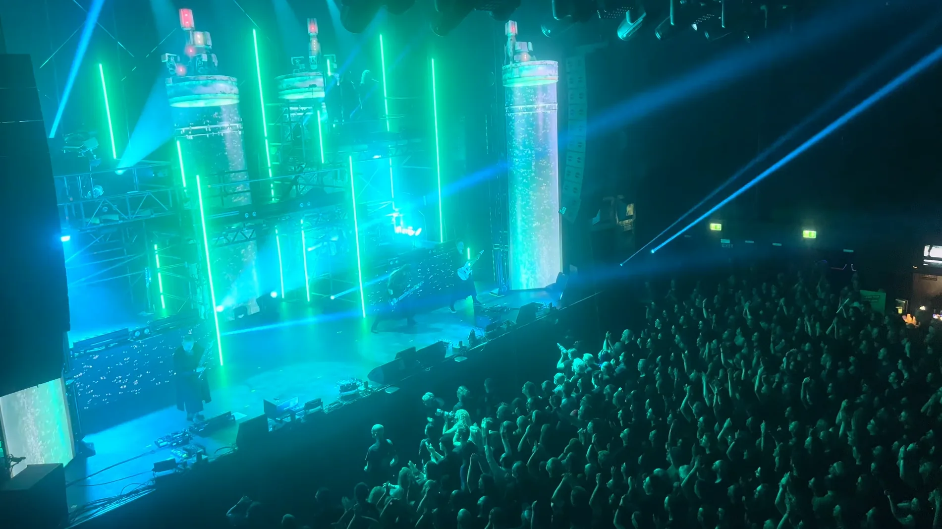 Ayreon performing within turquoise live visuals designed as an extension of the physical stage